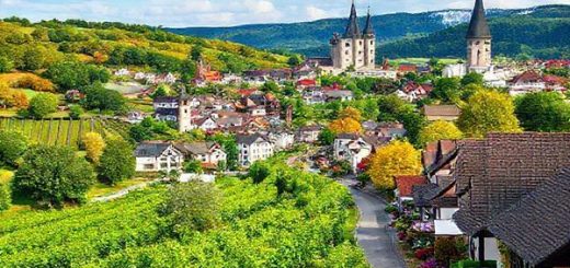 Create a high-definition image of the Romantic Road in Germany, showcasing the picturesque landscape during each season: lush green vineyards and bustling towns in summer, a serene snowy wonderland during winter with charming Christmas markets, vibrant autumn foliage with red and gold leaves in fall, and blooming flowers with lively gardens in spring. Incorporate iconic fairy-tale castles and medieval towns throughout, capturing the enchanting atmosphere of this storybook route.