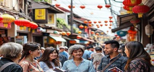 A vibrant Vietnamese street scene with locals conversing in fluent Vietnamese, colorful lanterns hanging overhead, and traditional foods on display. In the foreground, a diverse group of learners, from different backgrounds, is engaging in a lively language exchange, with books and mobile devices around them. The atmosphere is filled with cultural elements like traditional clothing, unique Vietnamese architecture, and street art. Capture this lively environment in high definition.