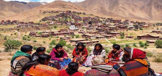 "A vibrant scene depicting a picturesque Andean landscape with traditional Aymara villages nestled among the mountains. A group of diverse learners of various ages sits in a circle, engaged in lively conversation with Aymara-speaking locals, surrounded by colorful textiles and cultural artifacts. The atmosphere is warm and inviting, showcasing deep cultural exchanges and the beauty of the Aymara heritage. High definition."