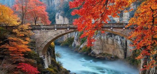 A breathtaking high-definition scene of Bastei Bridge during autumn, showcasing vibrant red, orange, and gold leaves cascading from ancient trees against stunning sandstone cliffs. The bridge arches gracefully over a swirling mist, with a tranquil Elbe River below, inviting hikers to explore the natural beauty of Saxon Switzerland National Park. The atmosphere is filled with crisp air and soft sunlight filtering through the foliage, creating a romantic and enchanting vibe.