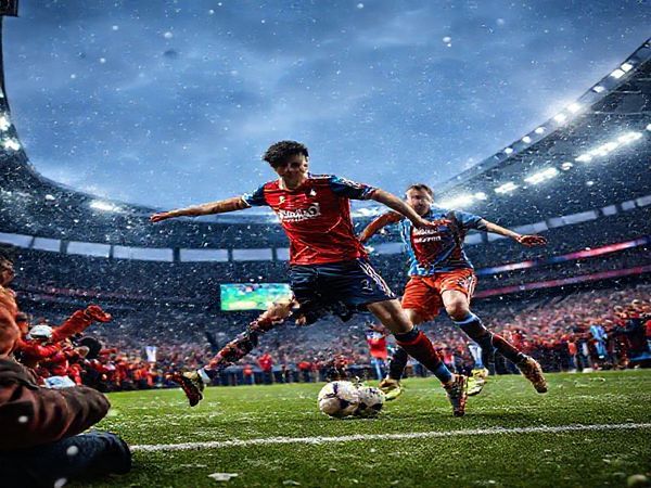 A high-definition image of a vibrant soccer match scene at St. Jakob-Park under a dramatic Swiss winter sky, showcasing bustling fans in red and blue jerseys, with Basel and Aston Villa players engaged in intense gameplay. Highlight the tactical dance between midfielders, capturing the flair of Basel's Isaac Alarcón in motion and the intensity of Aston Villa's Ollie Watkins. Convey the clash of cultures and styles in an electrifying atmosphere, with snow gently falling and stadium lights illuminating the scene.