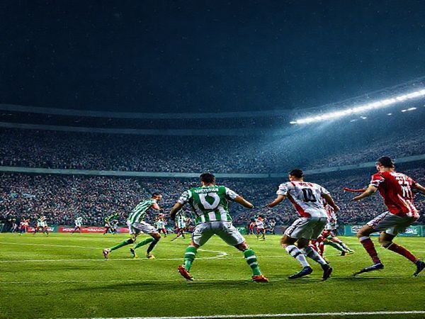High-definition image of an intense football match between Panathinaikos and Viktoria on a cold December night in 2025, featuring a packed stadium filled with passionate fans. Show the players in vibrant green and white jerseys for Panathinaikos, engaged in tactical formations, while Viktoria players in their red and white kits execute precise passes. Capture the electricity of the crowd, the strategic duel on the field, and the dramatic atmosphere under stadium lights, symbolizing a clash of cultures and footballing legacies.