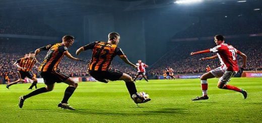 A dramatic football scene capturing a tense moment during the Championship match between Hull City and Middlesbrough, set in December 2025. The image showcases Hull City players in vibrant amber and black jerseys, pressing hard against a backdrop of a packed stadium, while Middlesbrough players in their red kits execute a precise pass. The atmosphere is electric, with fans waving flags, tension visible in the air, under the floodlights illuminating the pitch. Render this scene in high definition with a focus on dynamic movement and vivid colors.