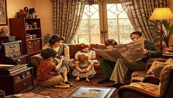 Create a high-definition image of a 1920s family gathered in a cozy living room, surrounded by vintage technology like a radio and a phonograph. The scene should be filled with warmth and optimism, featuring a mother teaching her children about faith, while a father reads a newspaper. The backdrop includes stylish Art Deco furniture and flapper-inspired decor, encapsulating the essence of the Roaring Twenties, symbolizing the blending of tradition and modernity in the Christian family.