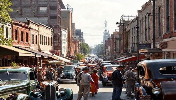 A vibrant 1930s street scene, showcasing the blend of hope and anxiety during the Great Depression. Imagine bustling urban life with people engaging in lively conversation, surrounded by early automobiles, a mix of modest and futuristic architecture, and innovative farming equipment in the background. Capture the contrasts between rural and urban community life, with lush greenery and a subtle whisper of technology, all in high definition.