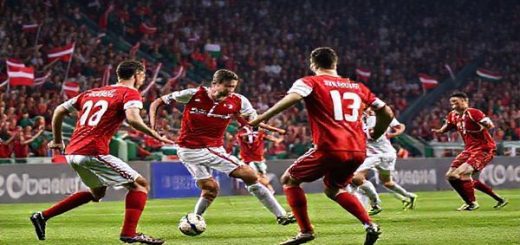 A tense football match scene showcasing Denmark versus Belarus in a World Cup qualifier, with Danish players in red and white jerseys executing a precise attack, while Belarus players in red and green defend vigorously. The stadium is packed with enthusiastic fans waving flags, creating an electric atmosphere. Capture the essence of tactical chess on the field, highlighting Denmark's efficiency and Belarus's gritty counter-attacks. Make the image in high definition.