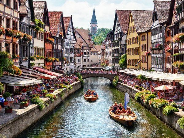 A vibrant summer scene in Tübingen, showcasing the lively atmosphere with cobbled streets lined with medieval architecture and bustling cafes. Capture the annual punting boat race on the glistening Neckar River, with colorful crowds enjoying picnics along the banks. Include blooming flowers and lush greenery, and ensure the image reflects the warmth and charm of this enchanting university town in high definition.